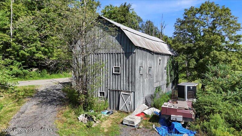 10846 Forest Lake Road Montrose, PA 18801 - Photo 34 of 42 a balcony view with a garden space