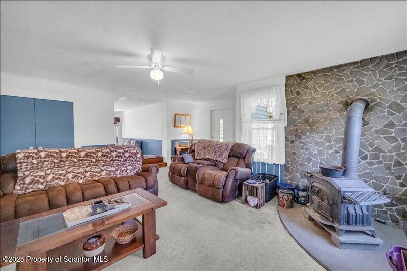 10846 Forest Lake Road Montrose, PA 18801 - Photo 7 of 42 a living room with furniture and a fireplace