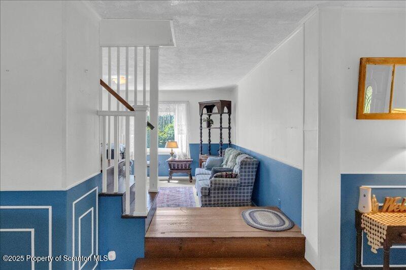 10846 Forest Lake Road Montrose, PA 18801 - Photo 8 of 42 a living room with furniture and a potted plant