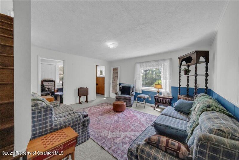 10846 Forest Lake Road Montrose, PA 18801 - Photo 9 of 42 a living room with furniture and a window