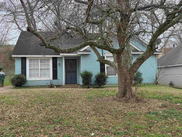 a house with trees in the background