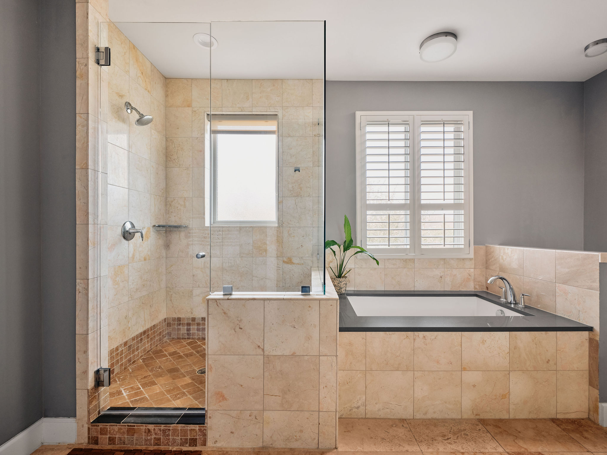 1504 Collier Street, Unit 4 Austin, TX 78704 - Photo 19 of 39 Bathroom featuring a stall shower and a garden tub