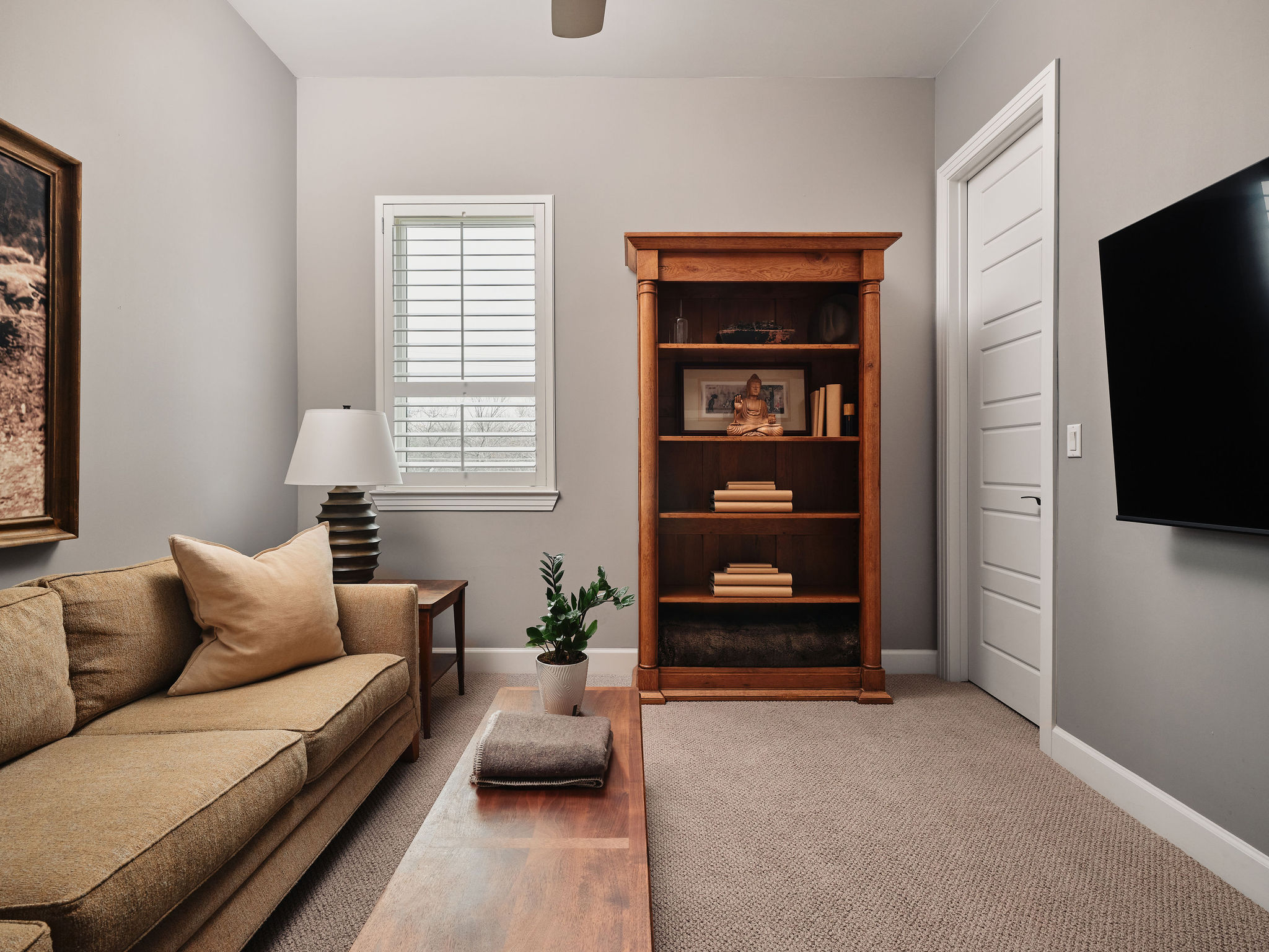 1504 Collier Street, Unit 4 Austin, TX 78704 - Photo 22 of 39 Living area featuring light colored carpet and ceiling fan