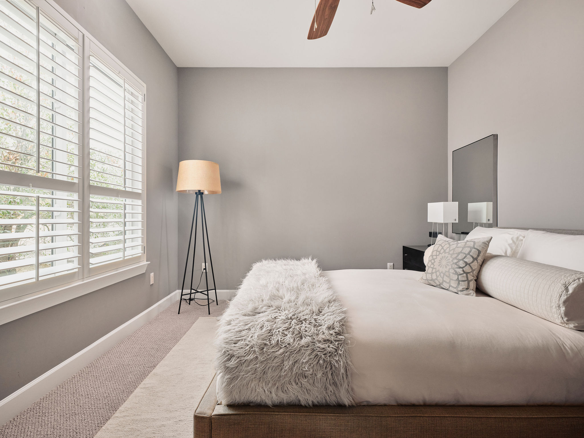 1504 Collier Street, Unit 4 Austin, TX 78704 - Photo 29 of 39 Carpeted bedroom featuring baseboards and ceiling fan