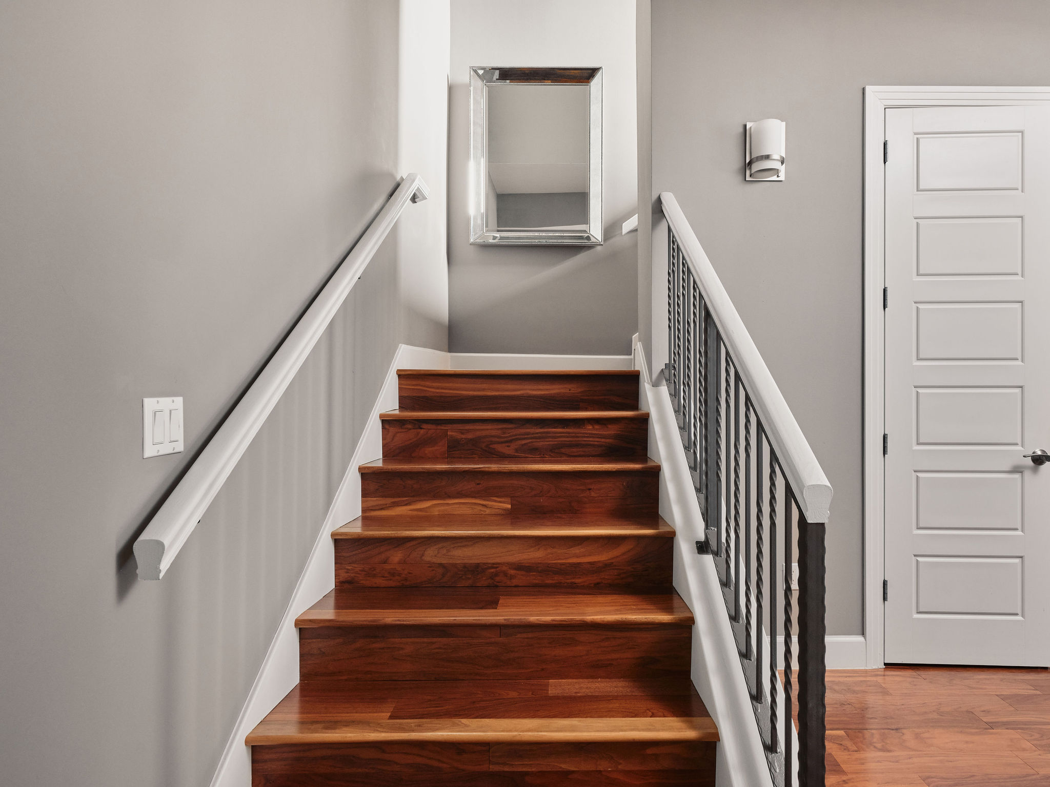 1504 Collier Street, Unit 4 Austin, TX 78704 - Photo 32 of 39 Staircase featuring wood finished floors and baseboards