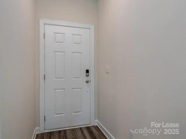 a kitchen with white cabinets and appliances