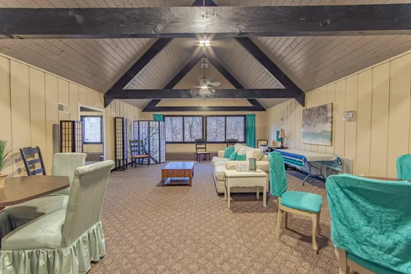 a view of a patio with table and chairs and potted plants