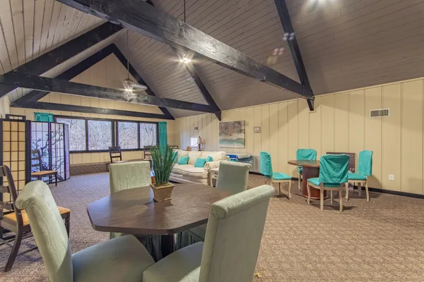 a kitchen with granite countertop a refrigerator and a sink