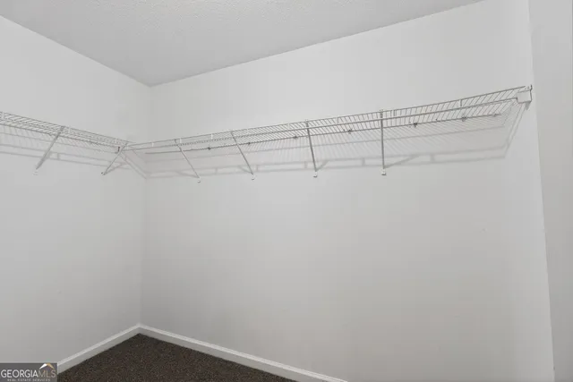 a view of a room with racks on the wall