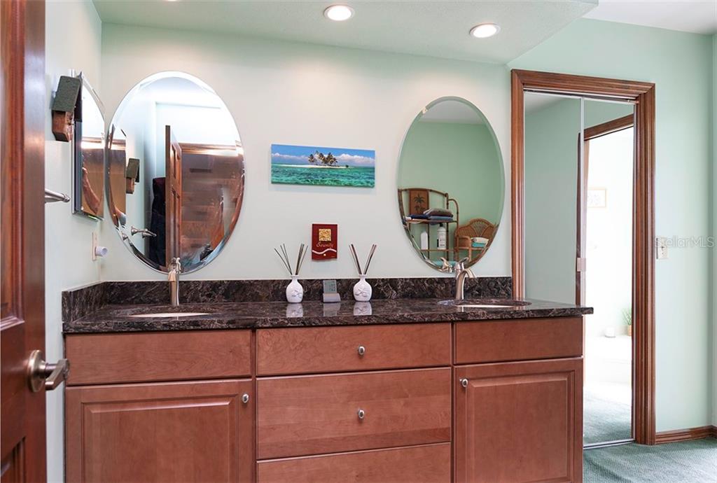 145 Spring Chase Circle Altamonte Springs, FL 32714 - Photo 21 of 54 Newer cabinet, granite countertop and mirrors in the master bathroom!