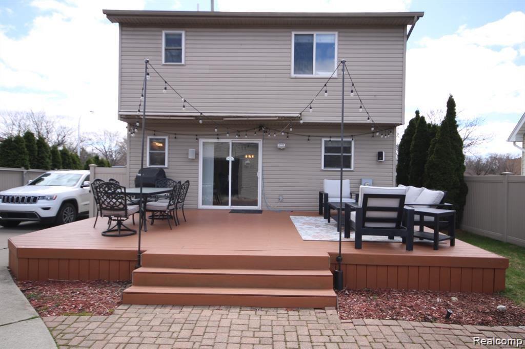 468 West 14 Mile Road Clawson, MI 48017 - Photo 23 of 24 Huge Trex deck (22x 15) with accent lights and electric operated awning.