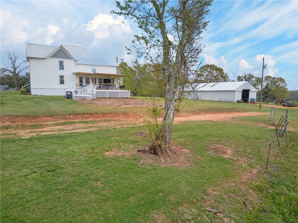3590 Roosterville Road Roopville, GA 30170 - Photo 65 of 66 a view of a house with a yard