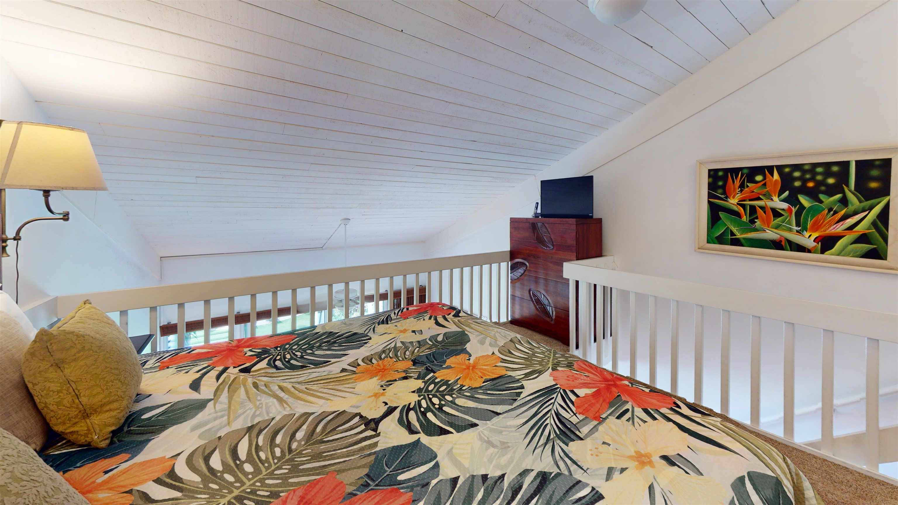 5255 Lower Honoapiilani Road, Unit 212 Lahaina, HI 96761 - Photo 11 of 17 a bedroom with furniture and a bed