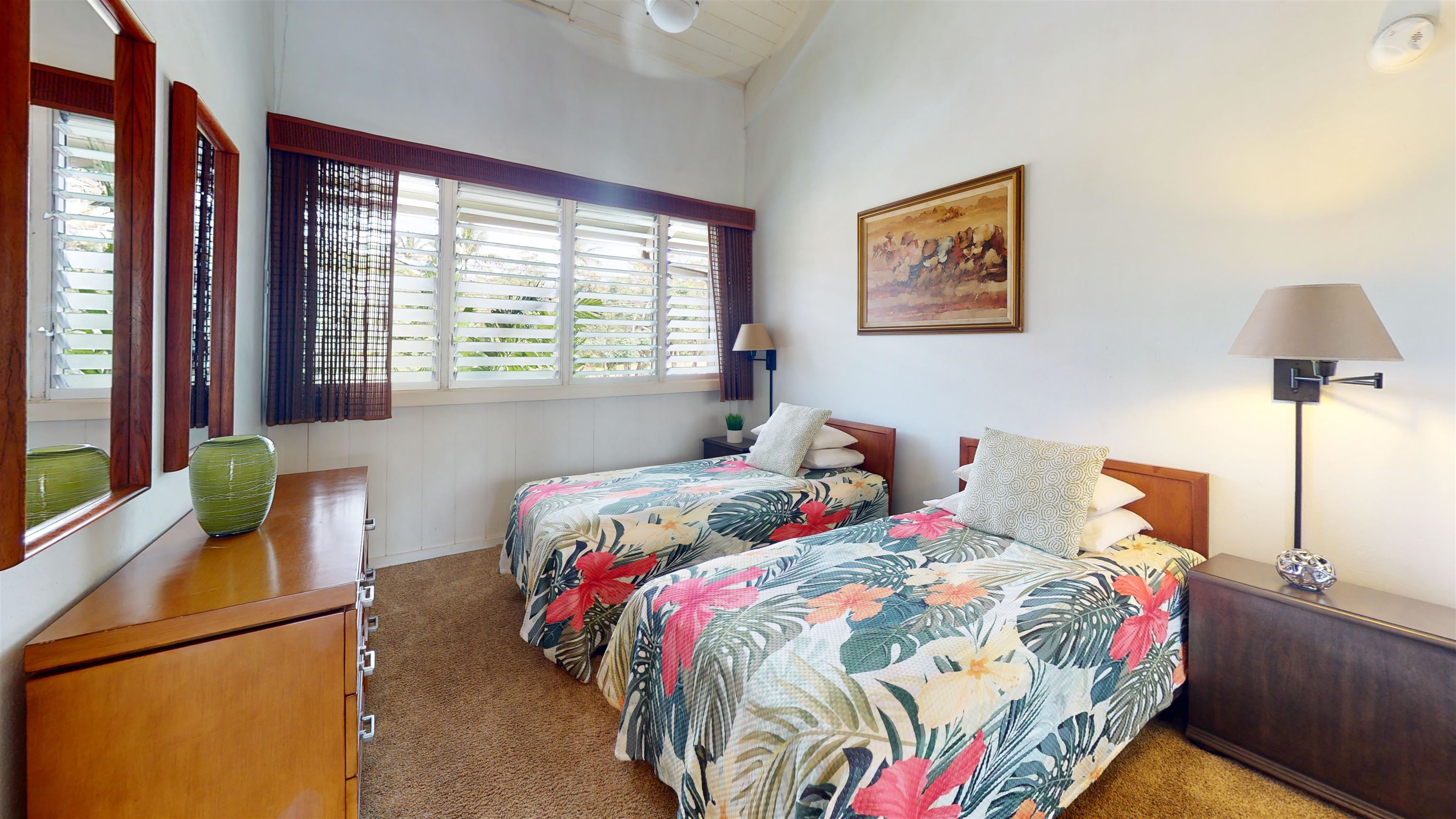 5255 Lower Honoapiilani Road, Unit 212 Lahaina, HI 96761 - Photo 9 of 17 a bedroom with a bed and a lamp