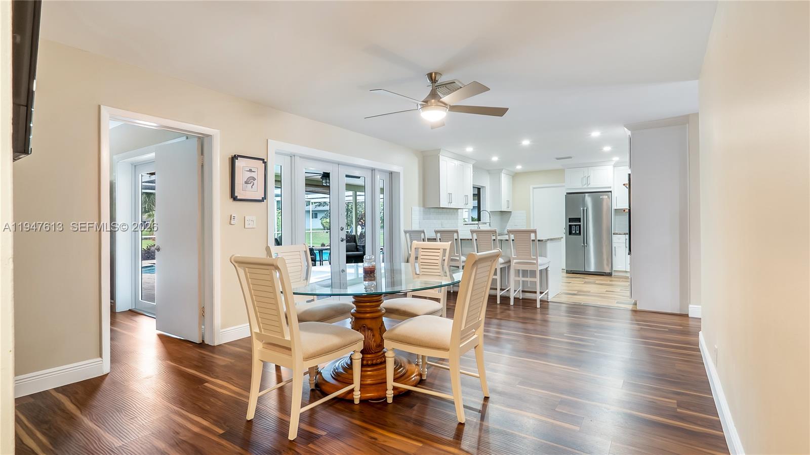 11071 Southwest 30th Court Davie, FL 33328 - Photo 12 of 44 a view of a dining room with furniture and wooden floor