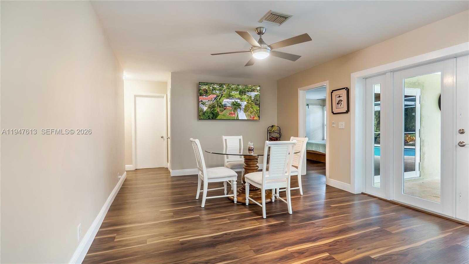 11071 Southwest 30th Court Davie, FL 33328 - Photo 13 of 44 a dining room with furniture and wooden floor