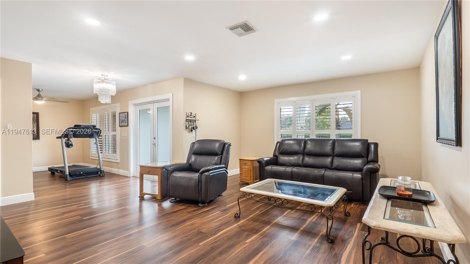 11071 Southwest 30th Court Davie, FL 33328 - Photo 2 of 44 a living room with furniture and wooden floor