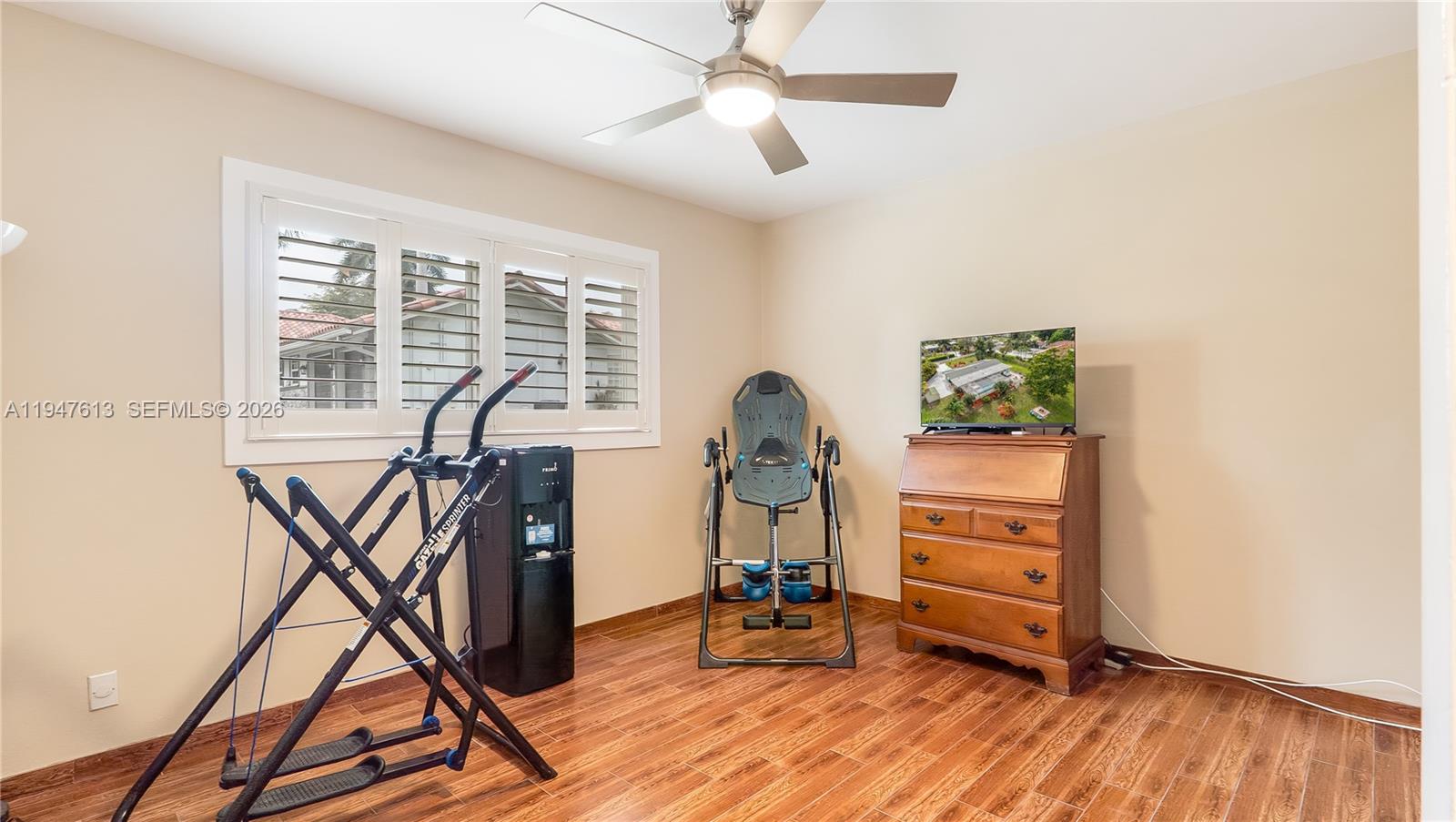 11071 Southwest 30th Court Davie, FL 33328 - Photo 23 of 44 a view of a livingroom with furniture and a ceiling fan