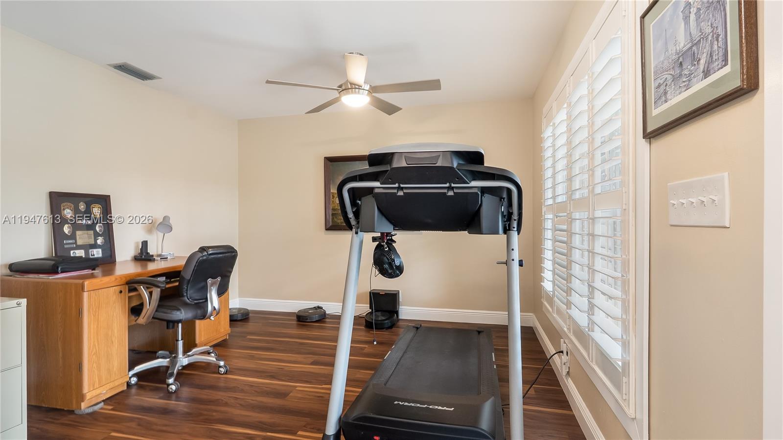 11071 Southwest 30th Court Davie, FL 33328 - Photo 25 of 44 a view of a workspace with furniture and wooden floor