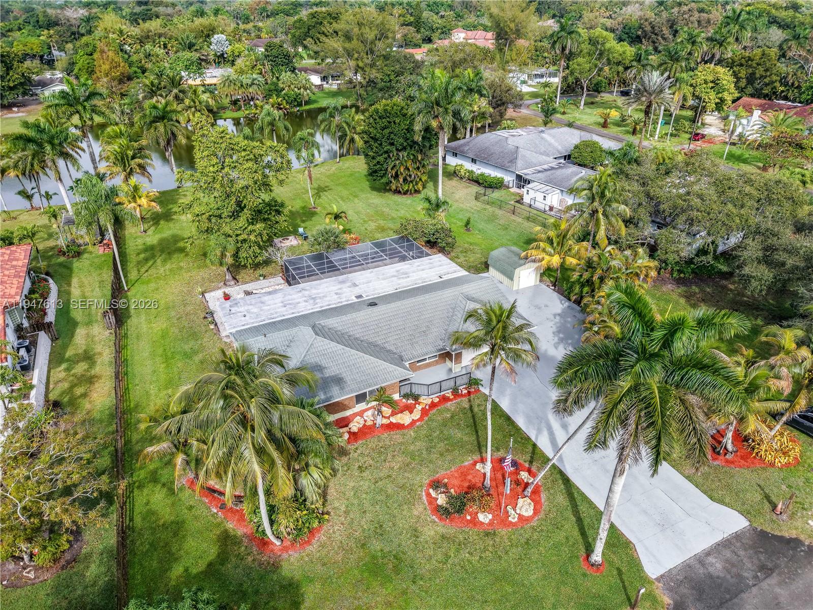 11071 Southwest 30th Court Davie, FL 33328 - Photo 39 of 44 an aerial view of a house swimming pool and red chairs