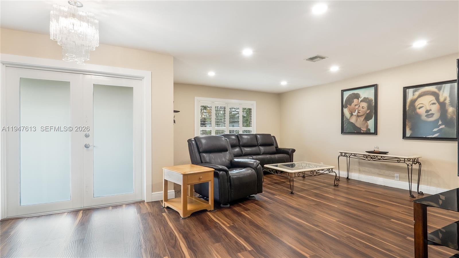 11071 Southwest 30th Court Davie, FL 33328 - Photo 4 of 44 a living room with furniture and a wooden floor