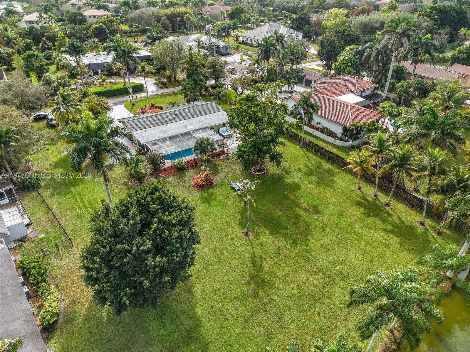 11071 Southwest 30th Court Davie, FL 33328 - Photo 42 of 44 an aerial view of residential houses with outdoor space and trees