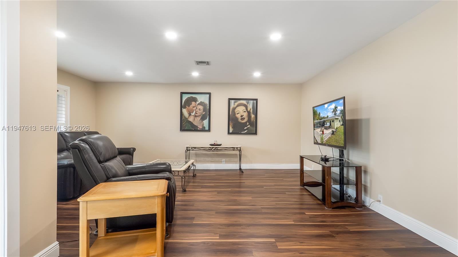 11071 Southwest 30th Court Davie, FL 33328 - Photo 5 of 44 a living room with furniture and a wooden floor