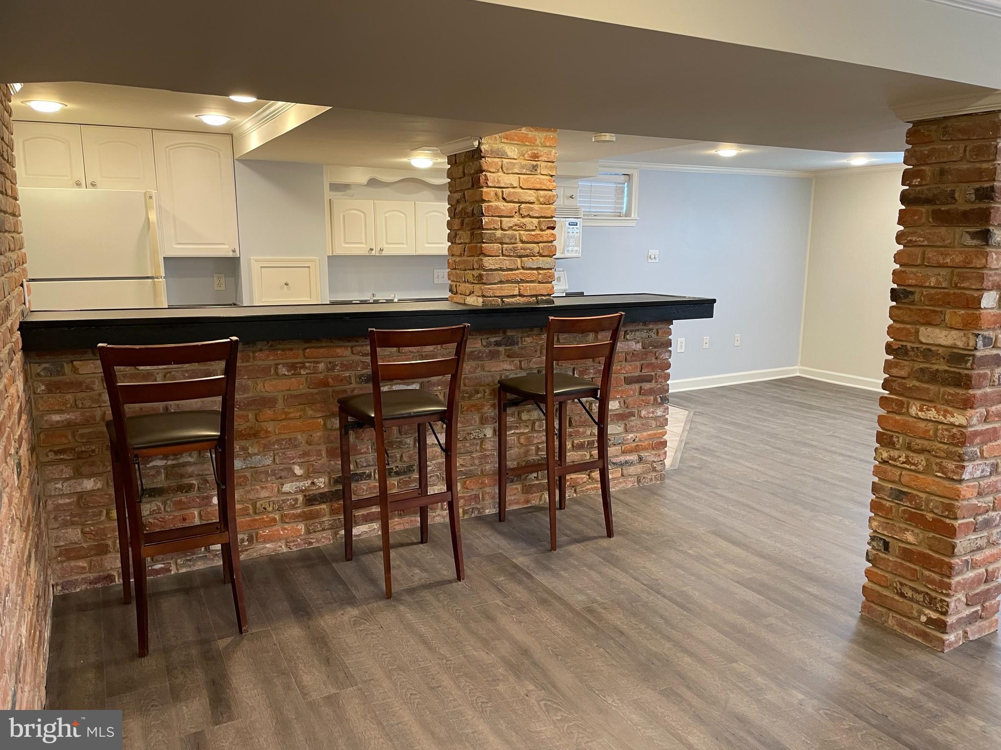 9713 Braddock Road Silver Spring, MD 20903 - Photo 14 of 16 Rec room with bar area