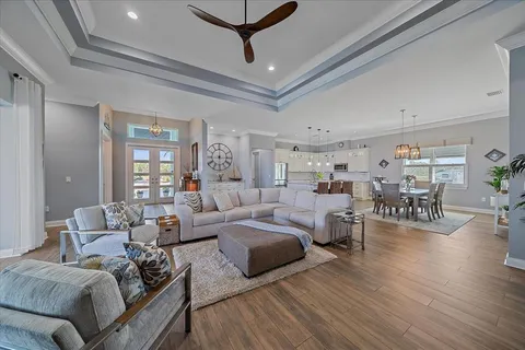 a view of a living room and dining area with furniture