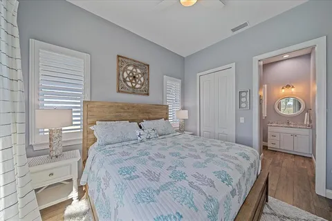 a bedroom with a bed and a dresser