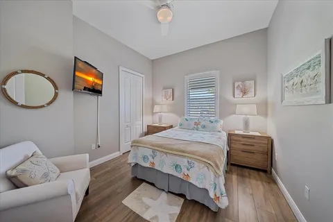 a bathroom with a granite countertop tub sink and mirror