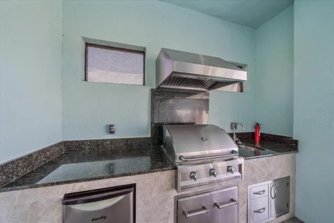 an aerial view of a house with a lake view