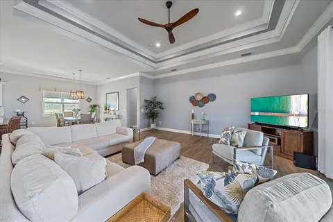 a view of a swimming pool and an outdoor seating