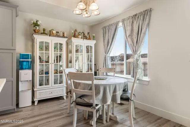 a view of a dining room with furniture window and wooden floor