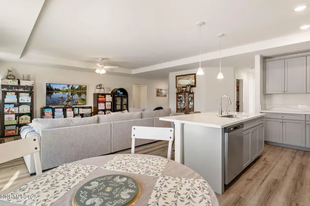 a kitchen with a sink and wooden cabinets