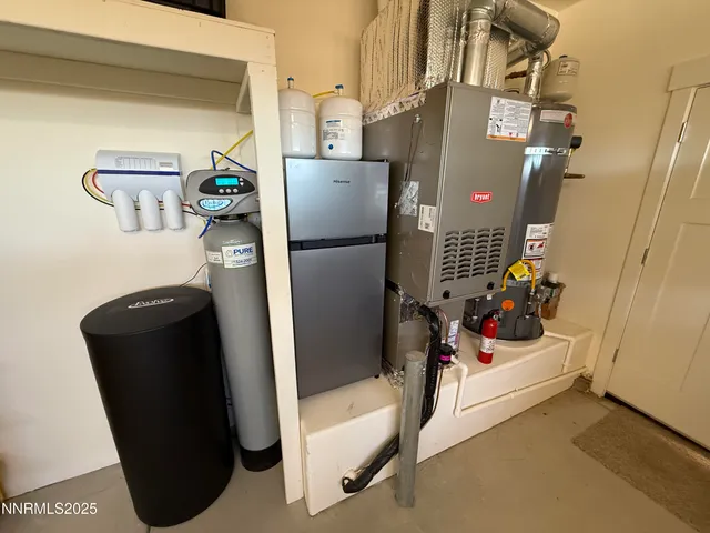 a bathroom with a refrigerator and washer