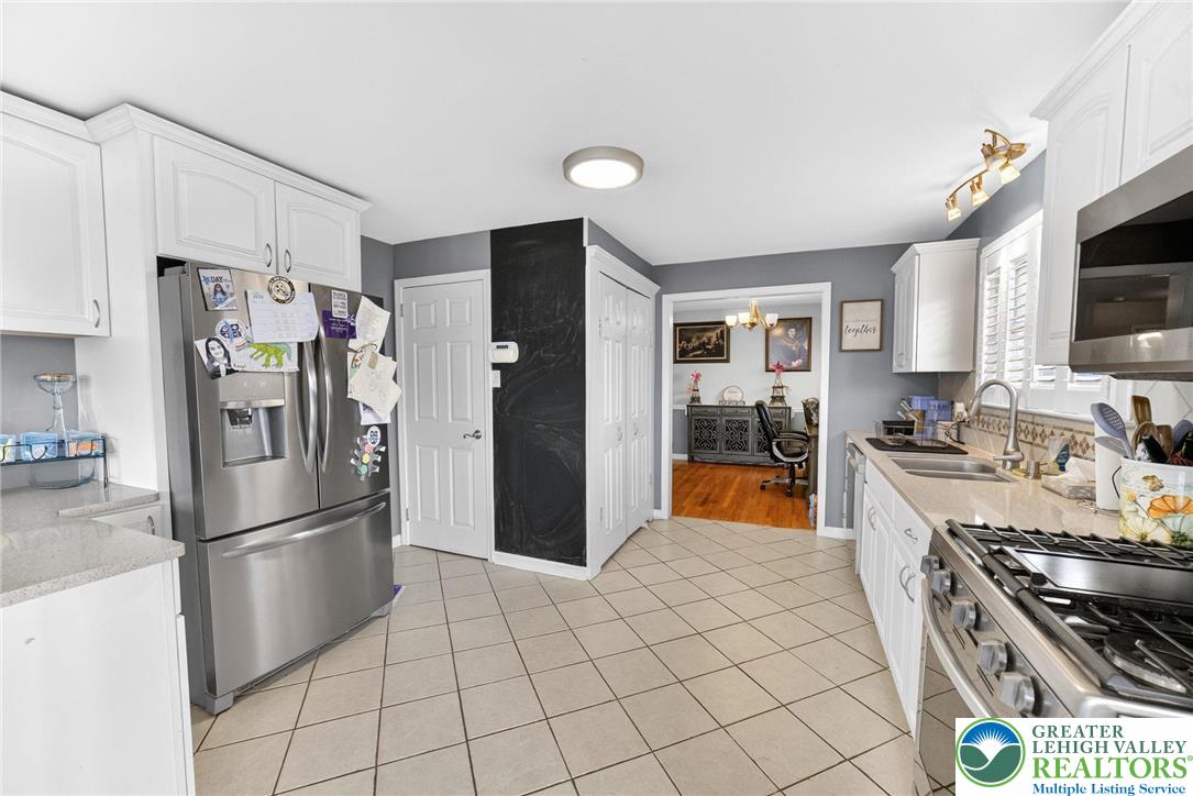 311 Lynoak Avenue Shillington, PA 19607 - Photo 11 of 40 a kitchen with stainless steel appliances granite countertop a refrigerator stove and sink