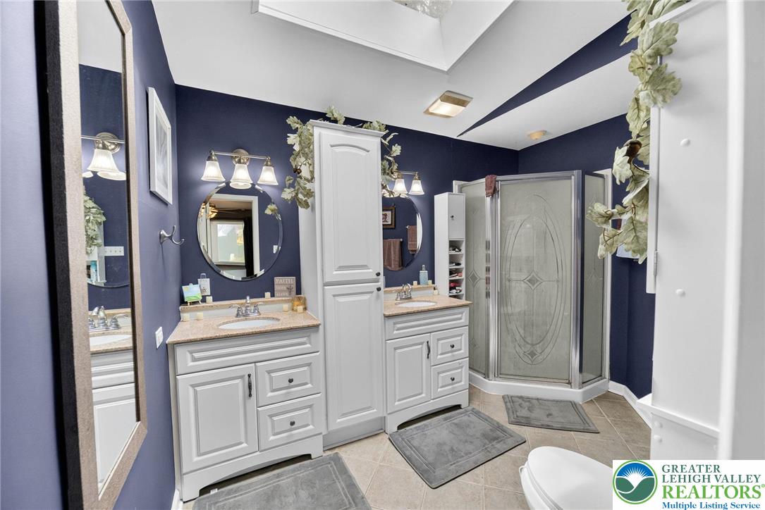 311 Lynoak Avenue Shillington, PA 19607 - Photo 17 of 40 a spacious bathroom with a double vanity sink mirror and shower