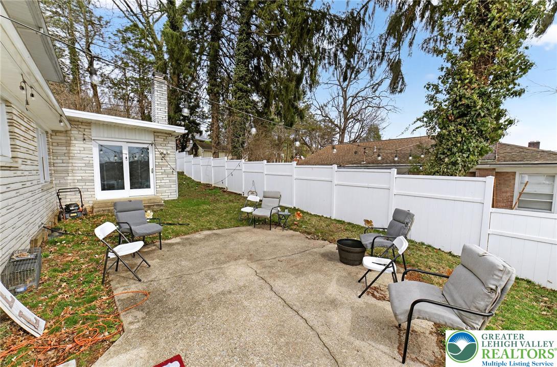 311 Lynoak Avenue Shillington, PA 19607 - Photo 31 of 40 front view of a house with patio chairs and a fire pit