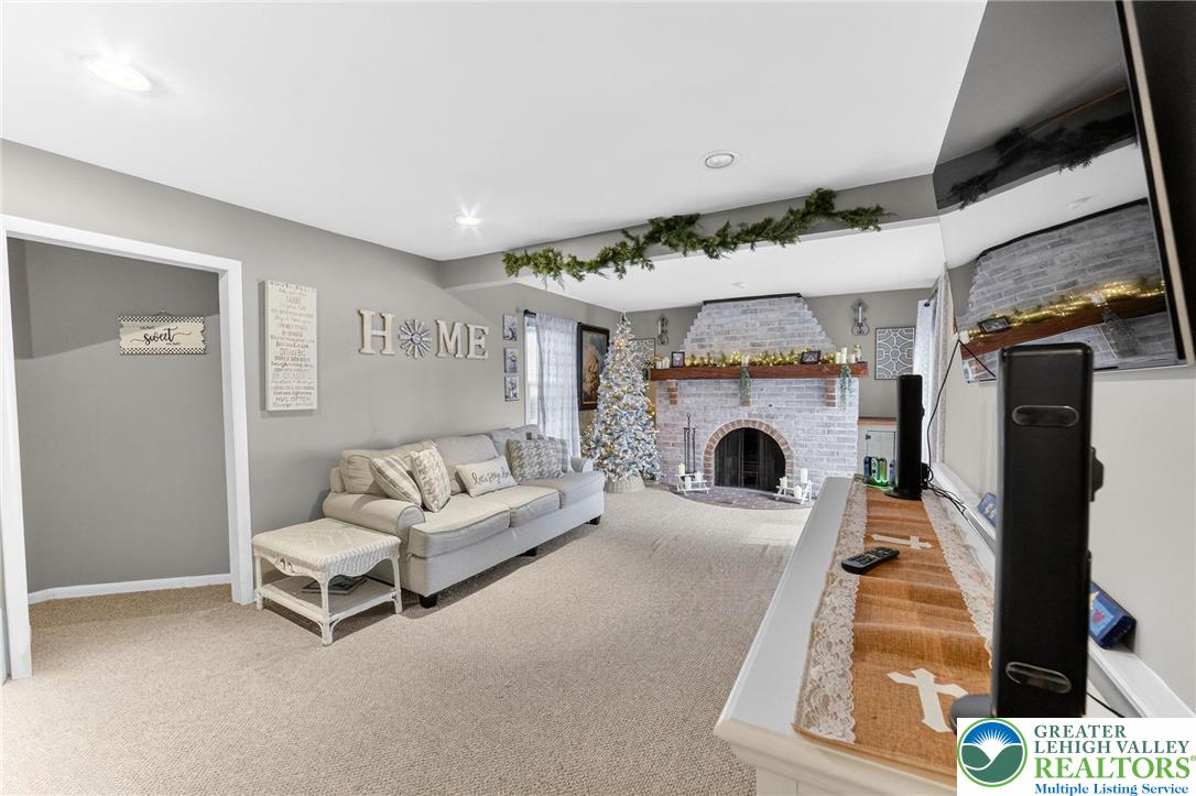 311 Lynoak Avenue Shillington, PA 19607 - Photo 8 of 40 a living room with furniture and a fireplace