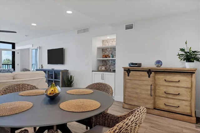 a living room with furniture and flat screen tv