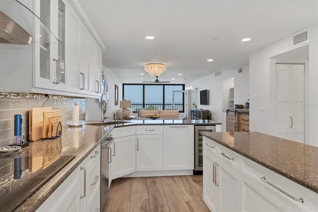 a kitchen with counter top space cabinets and appliances