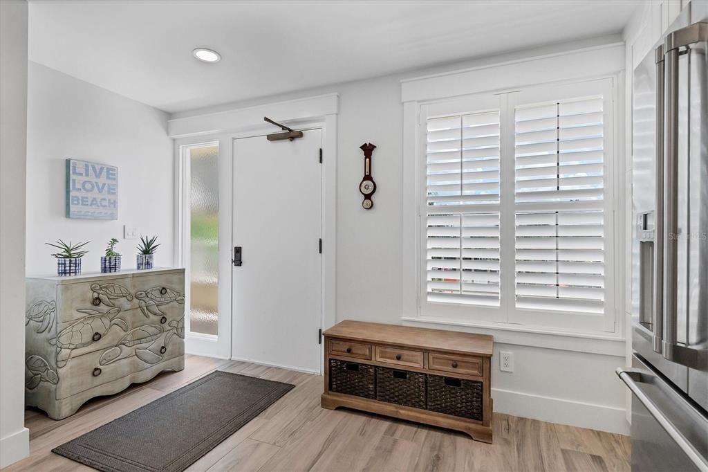 5740 Midnight Pass Road, Unit 303F Sarasota, FL 34242 - Photo 20 of 51 a room with furniture and a window