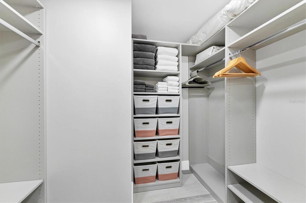 5740 Midnight Pass Road, Unit 303F Sarasota, FL 34242 - Photo 23 of 51 a view of walk in closet with empty racks