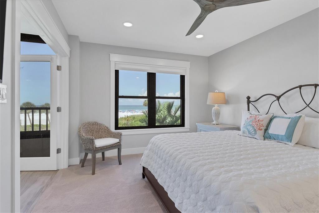5740 Midnight Pass Road, Unit 303F Sarasota, FL 34242 - Photo 26 of 51 a bedroom with bed and a window