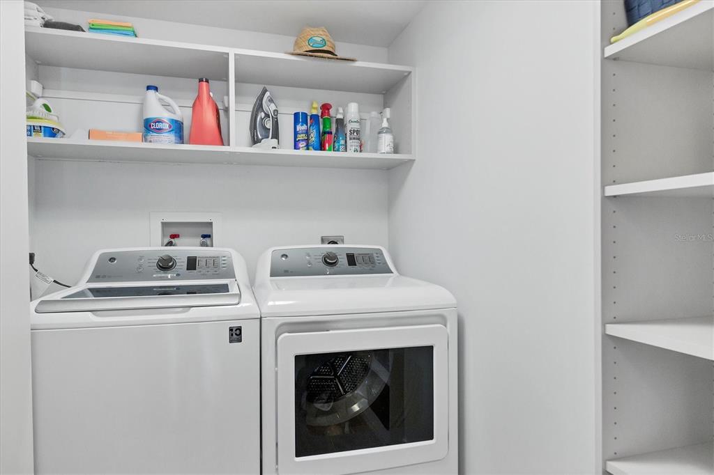 5740 Midnight Pass Road, Unit 303F Sarasota, FL 34242 - Photo 31 of 51 a utility room with dryer and washer
