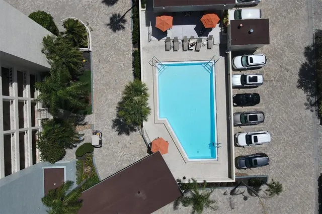 an aerial view of a house with street sign