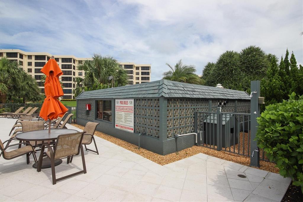 5740 Midnight Pass Road, Unit 303F Sarasota, FL 34242 - Photo 42 of 51 a view of a chairs and table in patio