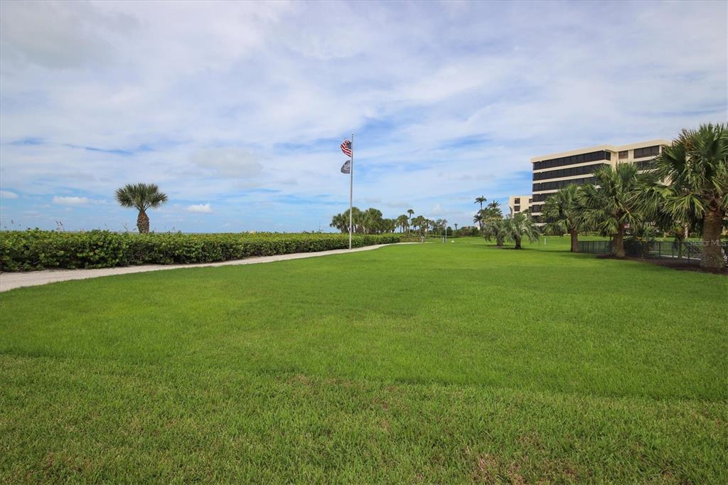 5740 Midnight Pass Road, Unit 303F Sarasota, FL 34242 - Photo 46 of 51 a view of a green field