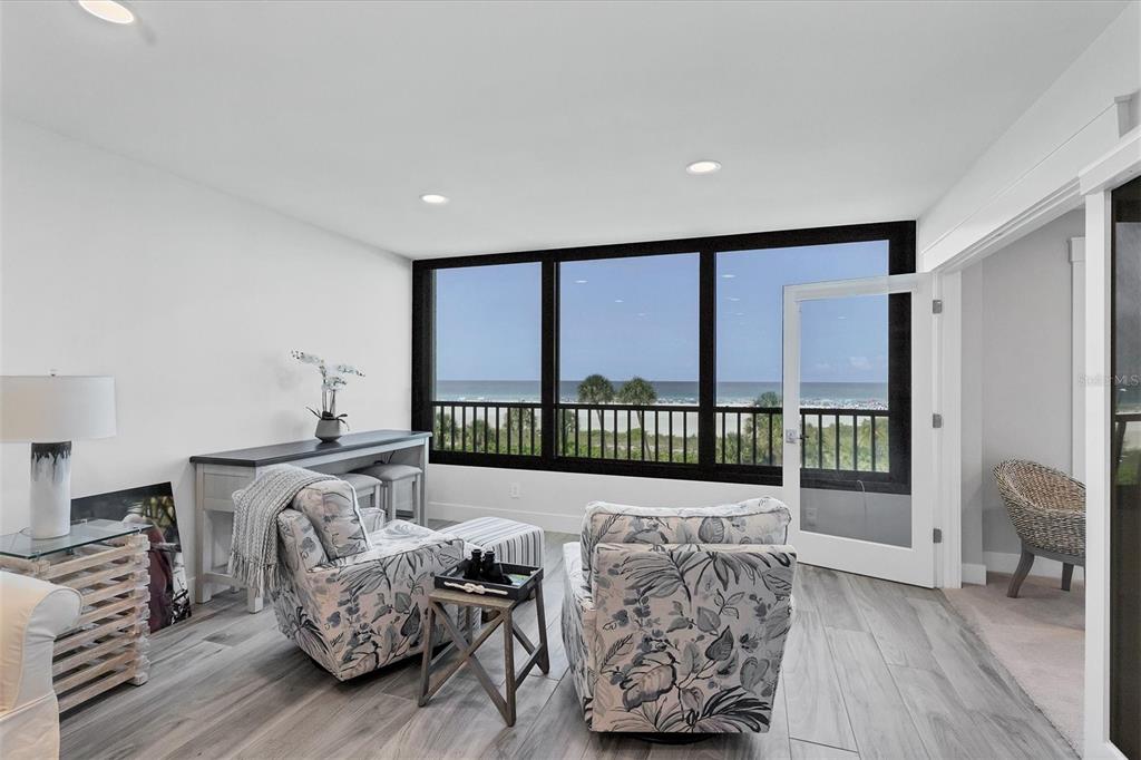 5740 Midnight Pass Road, Unit 303F Sarasota, FL 34242 - Photo 8 of 51 a living room with furniture